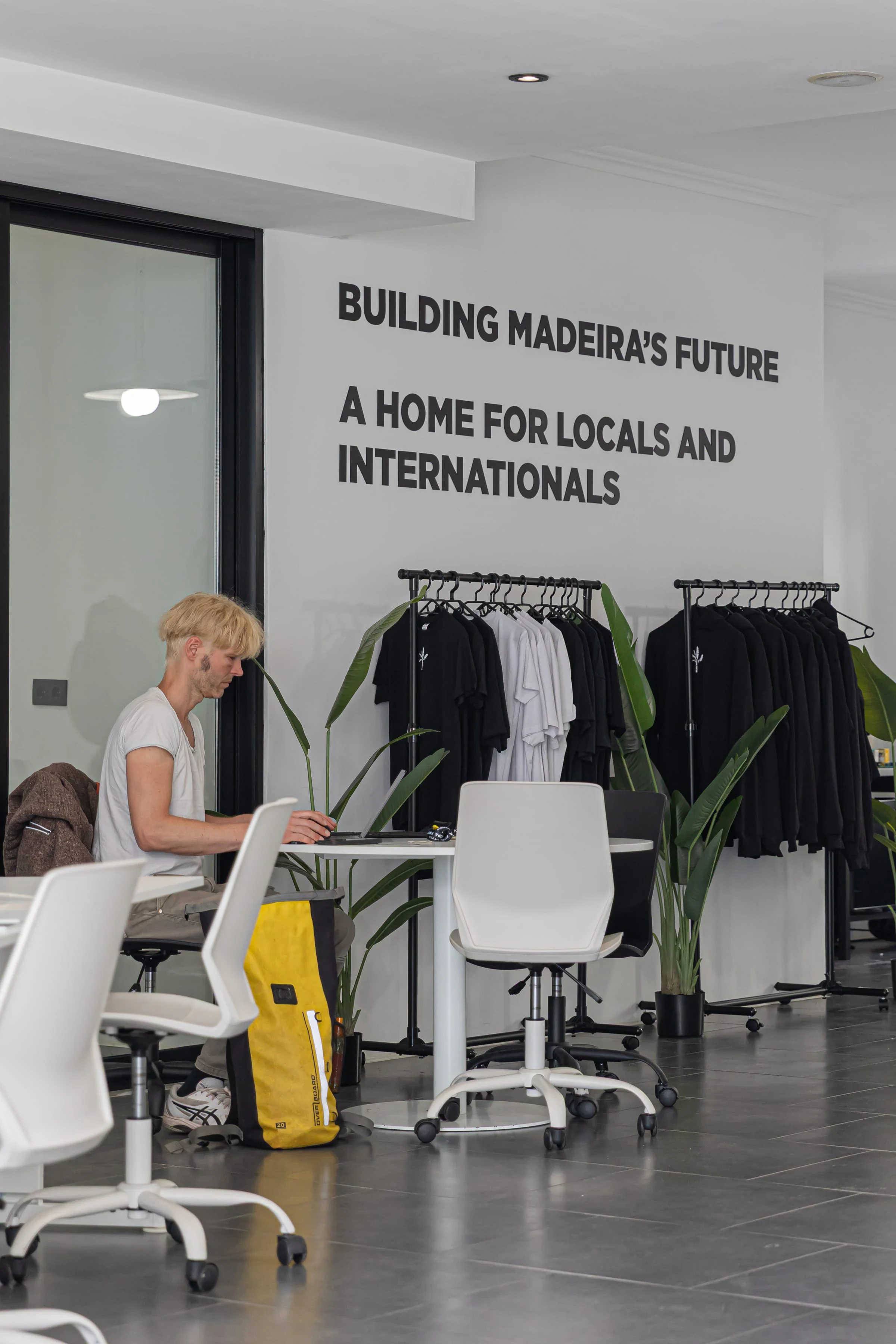 Member working at a desk in the coworking area